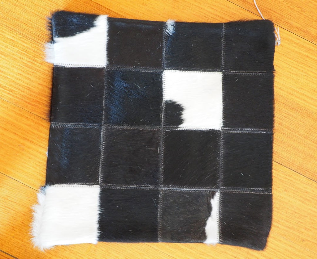 A CLASSIC BLACK & WHITE PATCHWORK COWHIDE CUSHION COVER