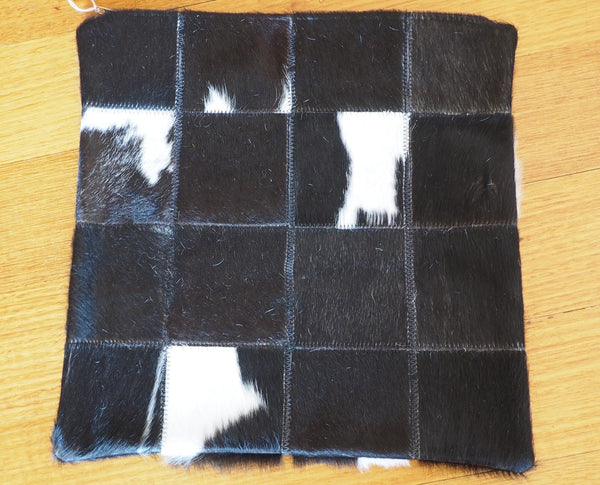 A CLASSIC BLACK & WHITE PATCHWORK COWHIDE CUSHION COVER