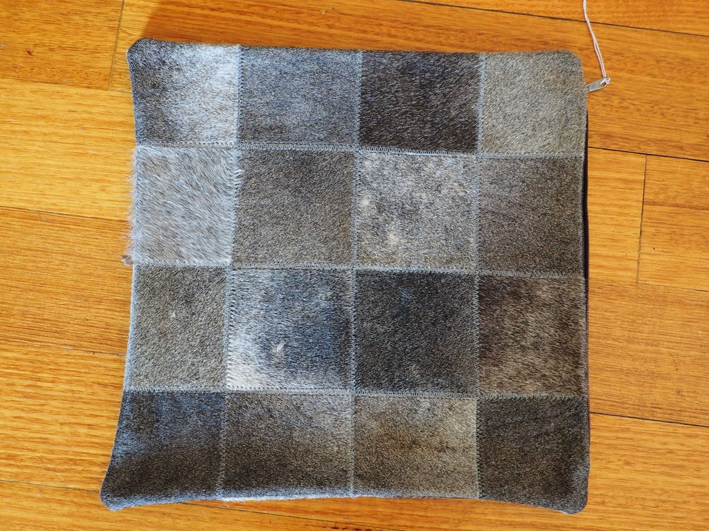 A STEEL GREY PATCHWORK COWHIDE CUSHION COVER